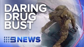 US Coast Guard leaps onto moving submarine filled with cocaine  Nine News Australia [upl. by Agatha]